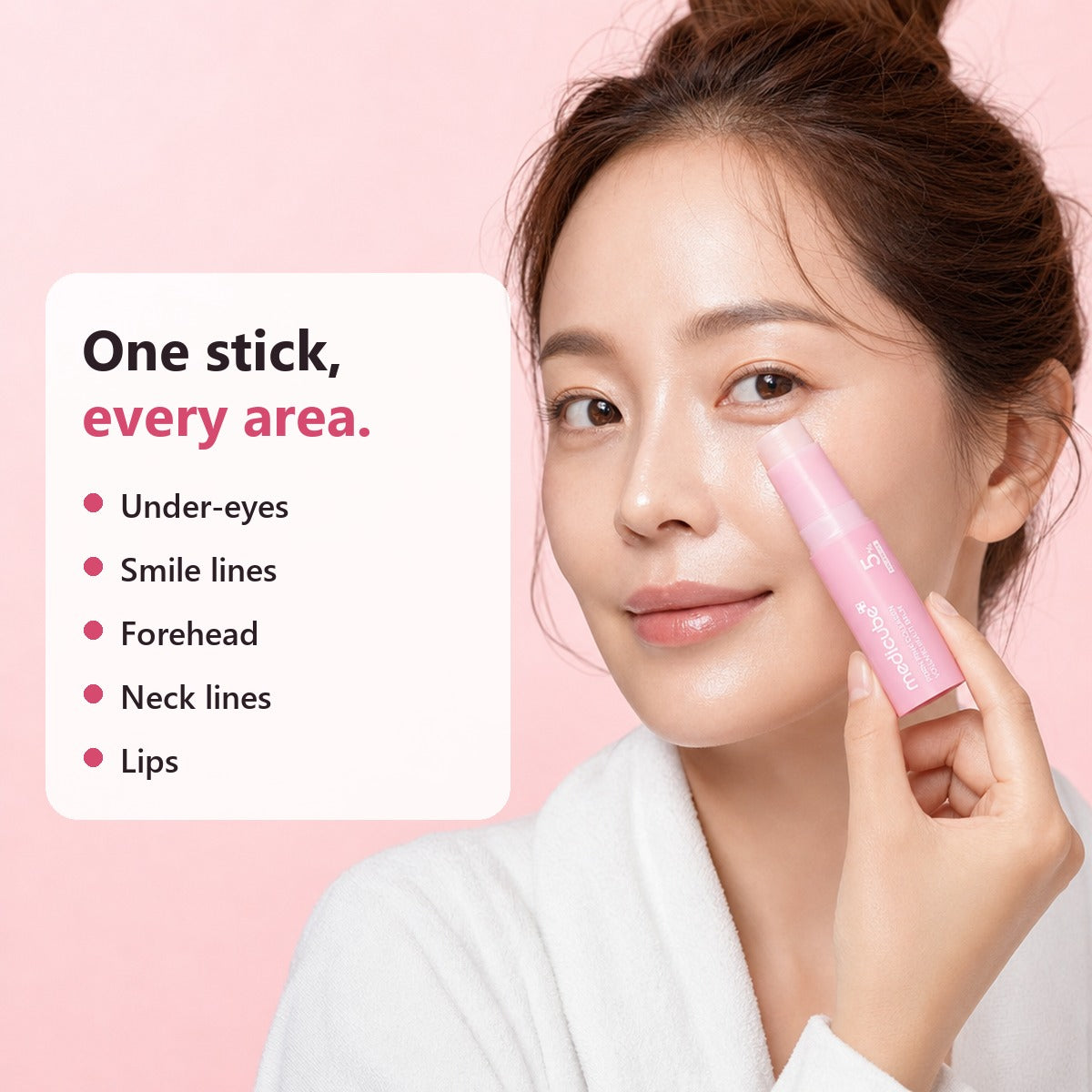 Woman applying the medicube multi balm under the eyes